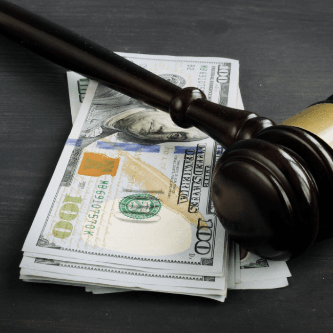 image showing a gavel and money for car accident attorney fees article